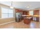 Well-lit kitchen featuring stainless steel appliances, center island, and ample cabinet space at 168 Melody Ln, Cameron, NC 28326