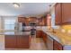 Modern kitchen with granite countertops, stainless steel appliances, and stylish cabinetry at 168 Melody Ln, Cameron, NC 28326