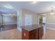 Kitchen island with granite countertop, storage, and open layout to other living spaces at 168 Melody Ln, Cameron, NC 28326