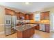 Spacious kitchen featuring stainless steel appliances, granite countertops, and abundant cabinetry at 168 Melody Ln, Cameron, NC 28326