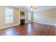 Spacious living room featuring a cozy fireplace and large windows offering natural light at 168 Melody Ln, Cameron, NC 28326