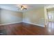 Open living room with hardwood floors, ceiling fan, and views of the entryway at 168 Melody Ln, Cameron, NC 28326