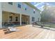 Spacious backyard deck perfect for entertaining with patio below, stairs, and bench at 1726 Rapids Ct, Franklinton, NC 27525