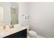 Neutral half bathroom featuring modern fixtures, and a shower at 1726 Rapids Ct, Franklinton, NC 27525