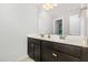 This bathroom features a double sink vanity with a large mirror and cabinet storage and a tiled floor at 1726 Rapids Ct, Franklinton, NC 27525