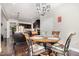 Charming dining area with wood table and upholstered chairs, opening to kitchen and living area at 1726 Rapids Ct, Franklinton, NC 27525