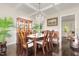 Elegant dining room featuring hardwood floors, coffered ceiling, and chandelier at 1726 Rapids Ct, Franklinton, NC 27525