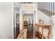 Elegant foyer with hardwood floors, staircase, and decorative console table at 1726 Rapids Ct, Franklinton, NC 27525