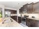 Well-equipped kitchen with granite counters, stainless steel appliances, and ample cabinet space at 1726 Rapids Ct, Franklinton, NC 27525