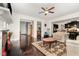 Open-concept living room with hardwood floors and a view into kitchen and dining room at 1726 Rapids Ct, Franklinton, NC 27525