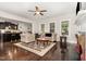 Cozy living room featuring hardwood floors, fireplace, and comfortable seating area at 1726 Rapids Ct, Franklinton, NC 27525