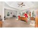 Spacious main bedroom features vaulted ceilings, ceiling fan, and large windows at 1726 Rapids Ct, Franklinton, NC 27525