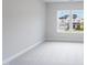 Bright bedroom with large windows offering a view of the neighborhood at 182 E Fountainhead Ln, Garner, NC 27529