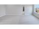 Spacious bedroom with neutral carpet and a doorway leading to a walk-in closet at 182 E Fountainhead Ln, Garner, NC 27529