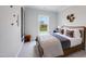 Cozy bedroom with a comfortable queen-size bed, soft carpet, and natural light at 182 E Fountainhead Ln, Garner, NC 27529