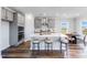 Spacious kitchen with gray cabinets, stainless steel appliances, and a large center island with seating at 182 E Fountainhead Ln, Garner, NC 27529