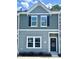 Charming townhouse with gray siding, black shutters, and well-maintained landscaping at 189 Seville Way, Clayton, NC 27520