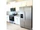 Modern kitchen boasting stainless steel appliances and sleek countertops at 189 Seville Way, Clayton, NC 27520