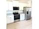 Modern kitchen with stainless steel appliances and sleek countertops at 189 Seville Way, Clayton, NC 27520