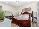 Cozy bedroom featuring a wooden bed frame, soft lighting, and calming decor at 190 Mitchells Chapel Road, Pittsboro, NC 27312