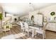 Open dining area featuring a chandelier, designer accents, and abundant natural light at 190 Mitchells Chapel Road, Pittsboro, NC 27312