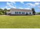 Home with a well-manicured lawn, white siding, and black trim at 190 Mitchells Chapel Road, Pittsboro, NC 27312