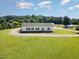 Sprawling property showcasing a white-sided home surrounded by lush greenery at 190 Mitchells Chapel Road, Pittsboro, NC 27312