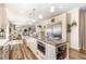 Large kitchen island with granite countertops and stainless steel appliances open to a dining and living area at 190 Mitchells Chapel Road, Pittsboro, NC 27312