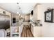 Bright kitchen showcasing ample cabinet space, a granite countertop, stainless steel appliances, and an island at 190 Mitchells Chapel Road, Pittsboro, NC 27312