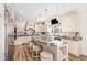 Spacious kitchen with light cabinets, granite countertops, a large island, and stainless steel appliances at 190 Mitchells Chapel Road, Pittsboro, NC 27312