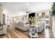 Open-concept living room with fireplace, ample seating, and stylish decor at 190 Mitchells Chapel Road, Pittsboro, NC 27312