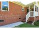 Brick house with covered back porch and well-manicured lawn at 1975 Oakridge Duncan Rd, Fuquay Varina, NC 27526