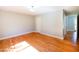Bedroom with hardwood floors, neutral walls, and a white door and trim at 1975 Oakridge Duncan Rd, Fuquay Varina, NC 27526