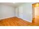 Bedroom with wood floors, neutral walls, and a pair of closets at 1975 Oakridge Duncan Rd, Fuquay Varina, NC 27526