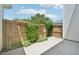 Private backyard features a wood fence with landscaping at 2101 Piney Brook Rd # 102, Raleigh, NC 27614