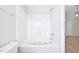 Modern bathroom with a jacuzzi tub and white tiled walls at 2101 Piney Brook Rd # 102, Raleigh, NC 27614