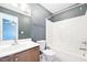 Neutral bathroom features a shower/tub combo and gray accent wall at 2101 Piney Brook Rd # 102, Raleigh, NC 27614