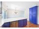 Bright kitchen featuring blue cabinetry, stainless steel appliances, and a chandelier at 2101 Piney Brook Rd # 102, Raleigh, NC 27614