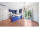 Kitchen with modern blue cabinets, stainless steel appliances, granite counters, and an island at 2101 Piney Brook Rd # 102, Raleigh, NC 27614