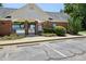 Community pool entrance framed in brick with black metal gate at 2101 Piney Brook Rd # 102, Raleigh, NC 27614