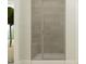 Modern shower with tiled walls, glass doors, and a built-in shower bench at 211 Tennyson Dr, Garner, NC 27529