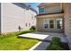 View of the backyard concrete patio with green grass at 2129 Glade Valley Ln, Morrisville, NC 27560