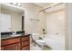 Bathroom with vanity sink, granite countertops, bathtub-shower combo, and neutral-toned decor at 2129 Glade Valley Ln, Morrisville, NC 27560