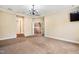 Versatile bonus room with carpeting, a ceiling fan, and easy access to the staircase at 2129 Glade Valley Ln, Morrisville, NC 27560