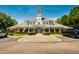 Image of the clubhouse with mature trees and dark trucks parked out front at 2129 Glade Valley Ln, Morrisville, NC 27560