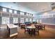 Well-lit community room with tables, chairs, and comfortable seating areas at 2129 Glade Valley Ln, Morrisville, NC 27560