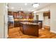 Gourmet kitchen with granite countertops, stainless steel appliances, and a large center island at 2129 Glade Valley Ln, Morrisville, NC 27560