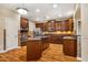 Kitchen boasts custom cabinetry, granite counters, stainless appliances, and hardwood floors at 2129 Glade Valley Ln, Morrisville, NC 27560