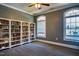 Cozy library room with built-in bookshelves and natural light from two windows at 2129 Glade Valley Ln, Morrisville, NC 27560