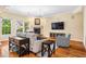 Inviting living room featuring a fireplace, neutral furniture, and large windows for natural light at 2129 Glade Valley Ln, Morrisville, NC 27560